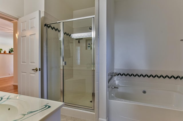 bathroom with plus walk in shower and vanity