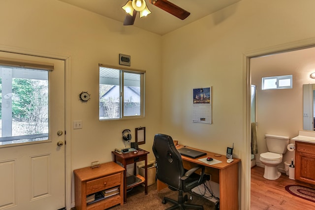 office area with ceiling fan and light hardwood / wood-style floors