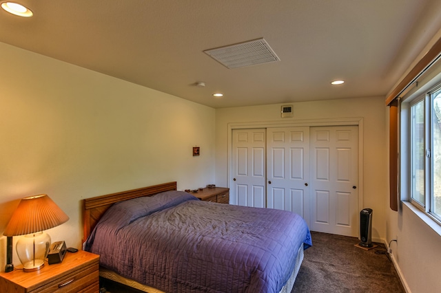 carpeted bedroom featuring a closet