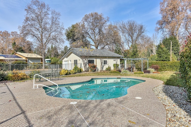 view of swimming pool with a patio