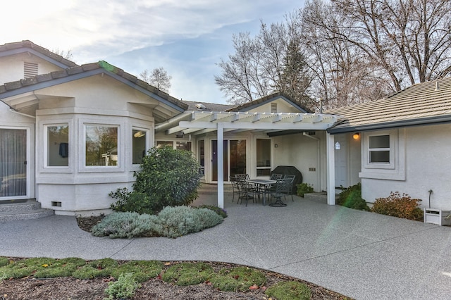 rear view of house with a patio