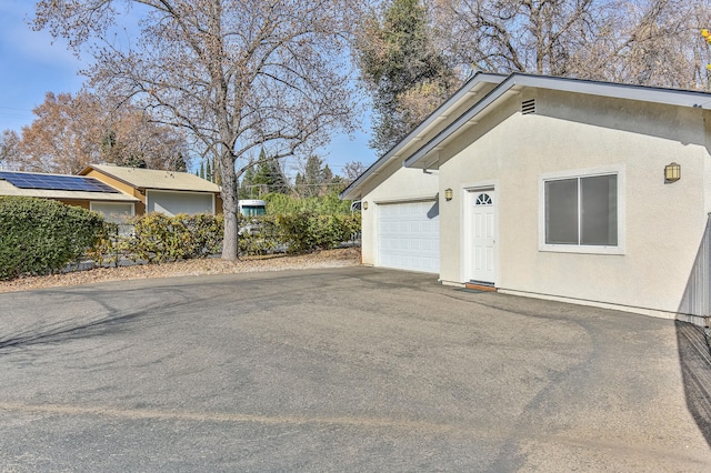 view of side of property with a garage