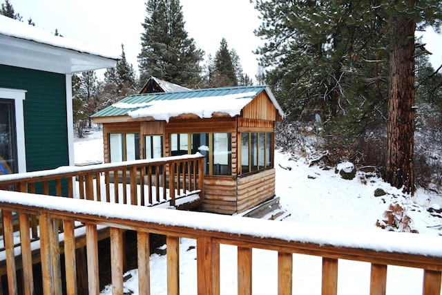 view of snow covered deck