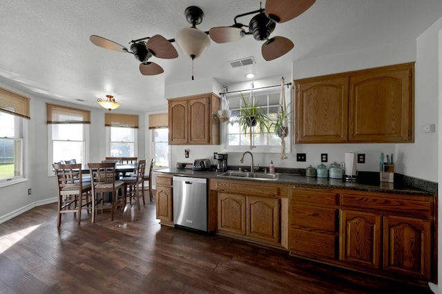 kitchen featuring dishwasher, ceiling fan, sink, and dark wood-type flooring