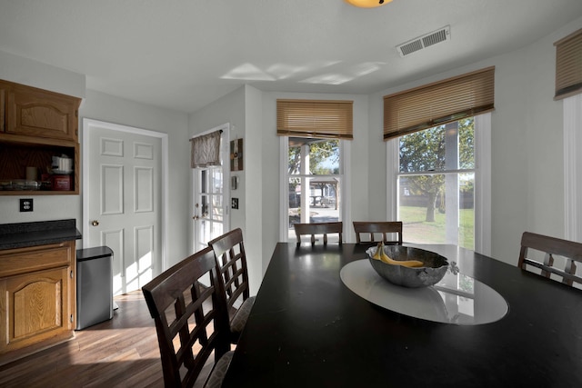 dining space featuring wood-type flooring