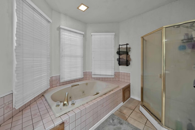 bathroom featuring tile patterned flooring and independent shower and bath