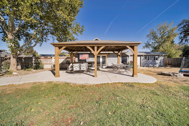 exterior space with french doors, a trampoline, and a gazebo