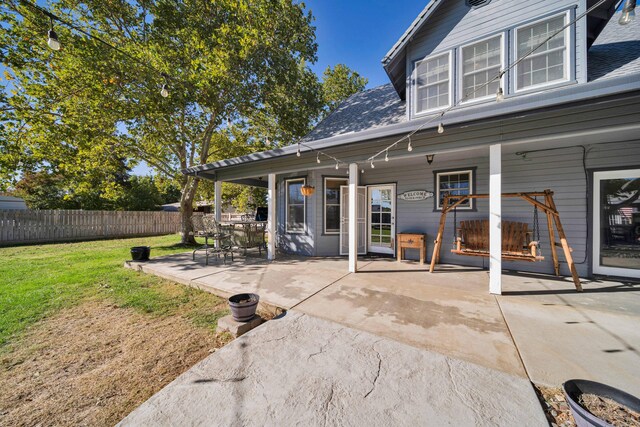 exterior space featuring a lawn and a patio