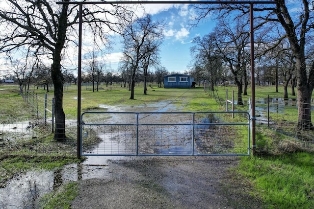 view of gate with a water view