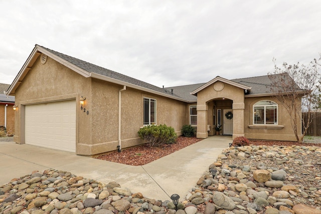 ranch-style house featuring a garage