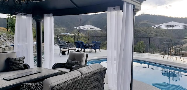 view of patio / terrace featuring a fenced in pool