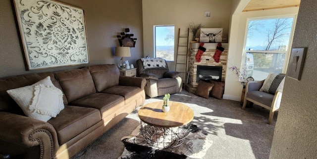 living room with carpet floors and a fireplace