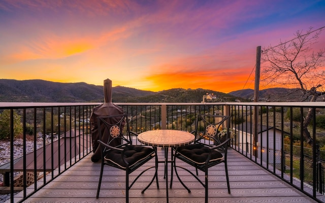 deck at dusk with a mountain view