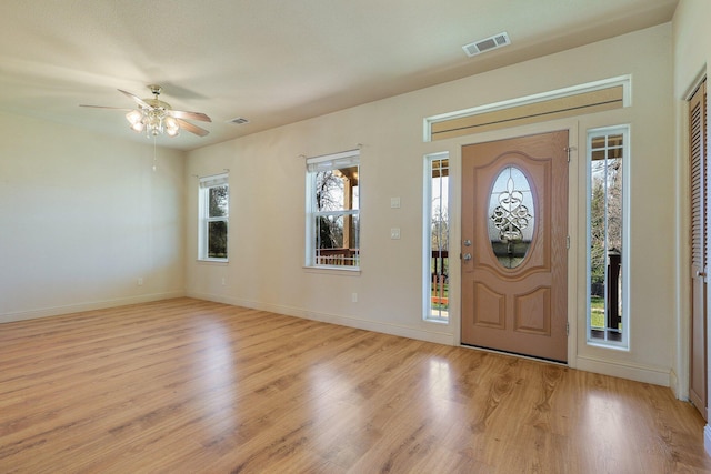7899 Elmers Way, Shingletown, CA 96088 - foyer entrance with light wood-style flooring, a ceiling fan, and baseboards