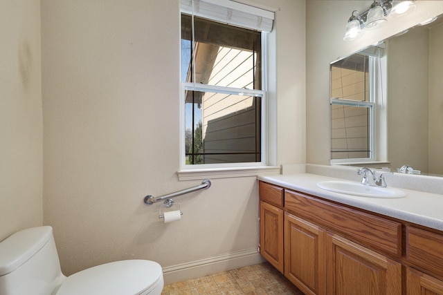 7899 Elmers Way, Shingletown, CA 96088 - bathroom with toilet, baseboards, and vanity