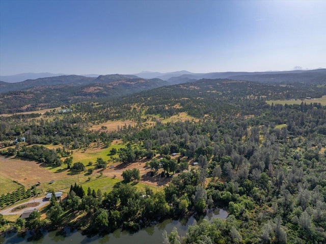 7899 Elmers Way, Shingletown, CA 96088 - drone / aerial view of a mountain backdrop and a heavily wooded area