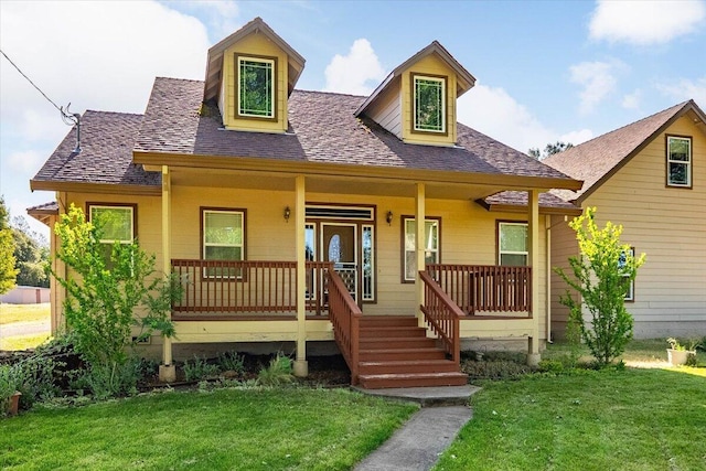 7899 Elmers Way, Shingletown, CA 96088 - view of front of home featuring a front yard, a shingled roof, and a porch