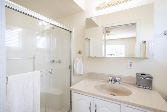 full bathroom featuring a shower stall and vanity