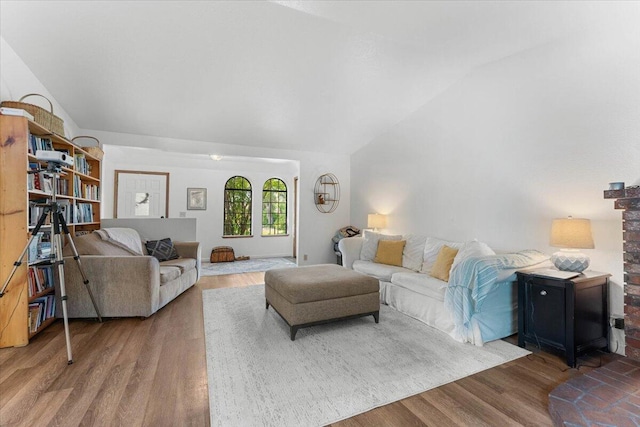 711 Teakwood Dr, Redding, CA 96003 - living room featuring vaulted ceiling and wood finished floors