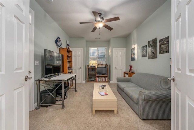 living room with light colored carpet and ceiling fan