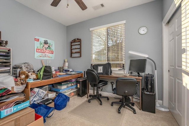 office with carpet floors and ceiling fan