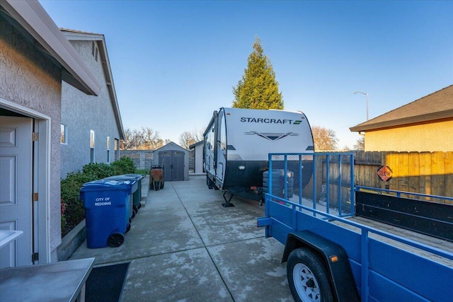 view of side of property featuring a shed