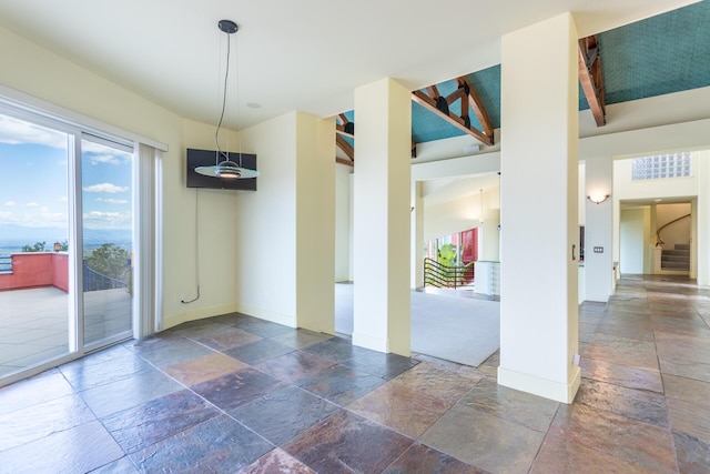 spare room featuring beam ceiling