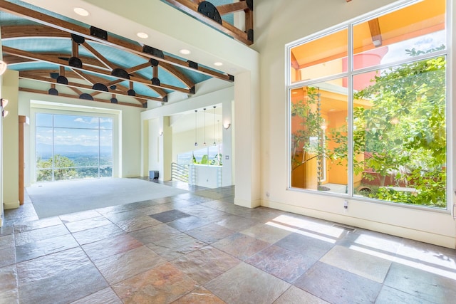 interior space featuring vaulted ceiling with beams