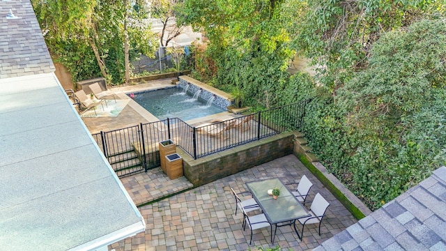 view of swimming pool with a patio area and pool water feature