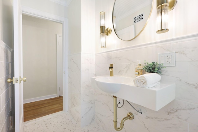 bathroom featuring tile walls and ornamental molding