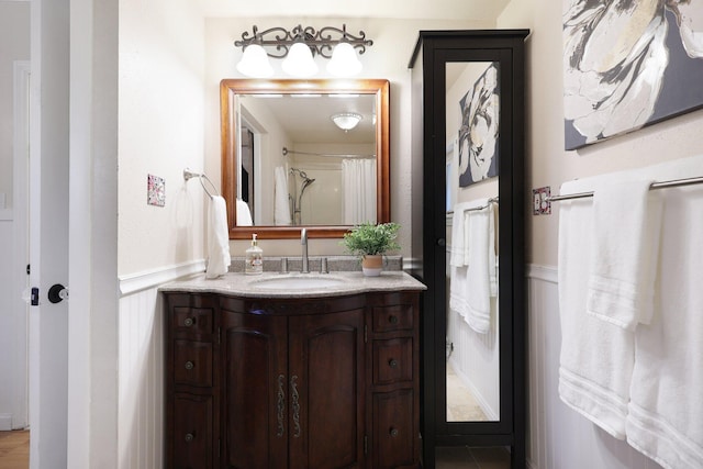 bathroom featuring vanity and walk in shower