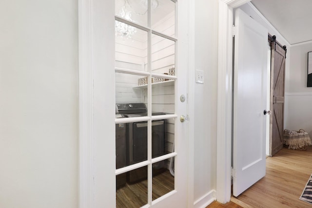 interior details with hardwood / wood-style floors and a barn door