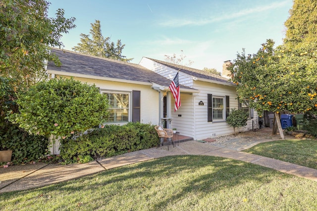 ranch-style house with a front yard