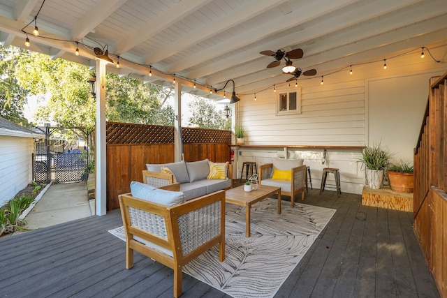 wooden deck featuring ceiling fan and an outdoor hangout area