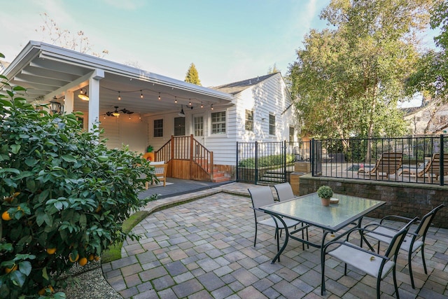 view of patio / terrace featuring ceiling fan