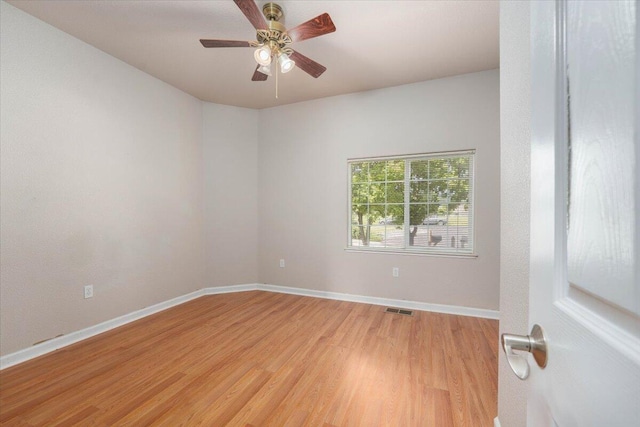 unfurnished room featuring light wood-type flooring and ceiling fan