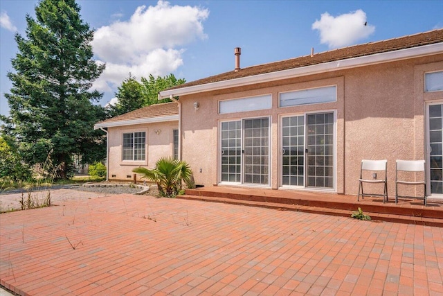 rear view of property featuring a patio area