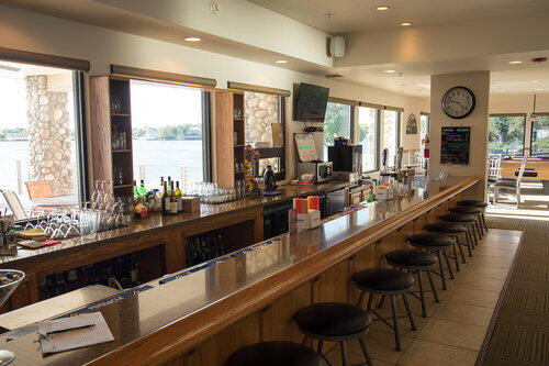 bar featuring light tile patterned flooring