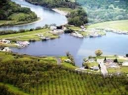 aerial view with a rural view and a water view