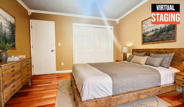 bedroom featuring wood-type flooring, a closet, and crown molding