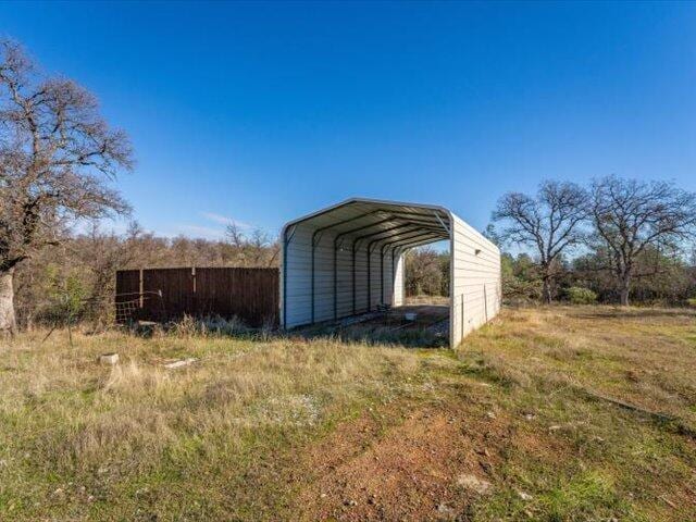 view of outdoor structure with a carport