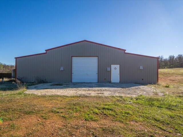 view of outbuilding featuring a garage