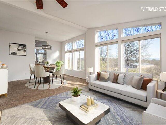 sunroom with ceiling fan and a wealth of natural light