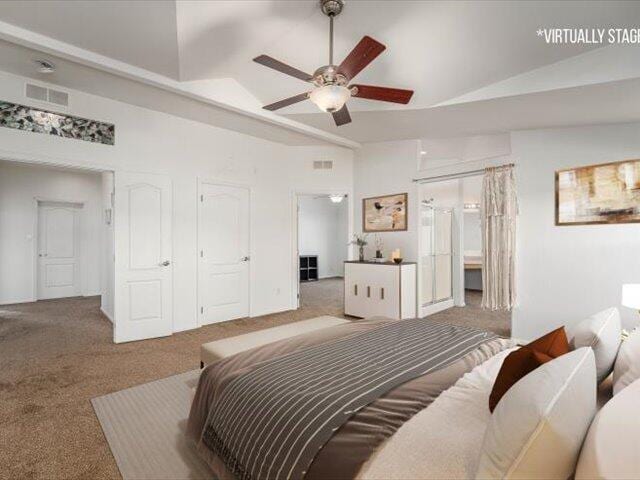 bedroom with ceiling fan, light colored carpet, and lofted ceiling