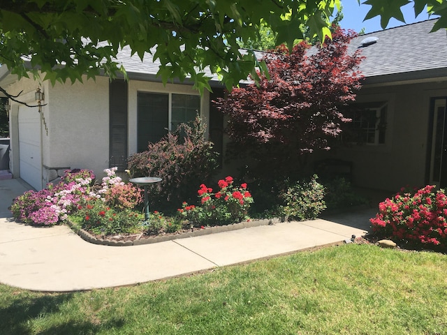 view of side of home featuring a lawn