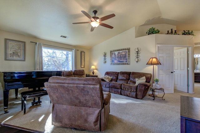 living room featuring ceiling fan, lofted ceiling, and light carpet