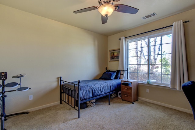 carpeted bedroom with ceiling fan