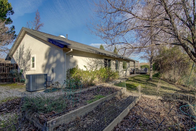 view of property exterior with cooling unit