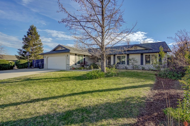 ranch-style home featuring a garage and a front lawn