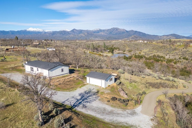 birds eye view of property featuring a mountain view